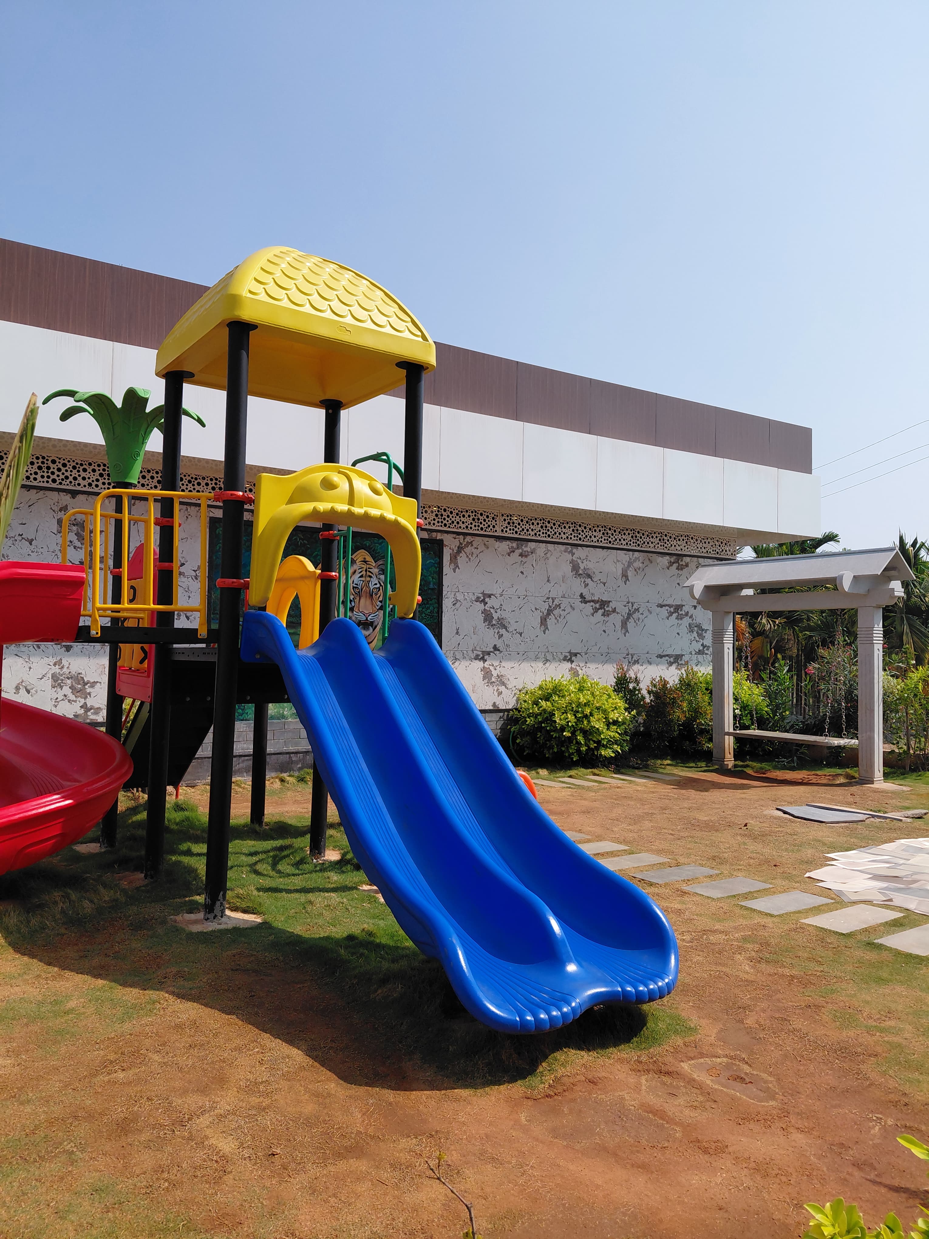 Colorful children's playground area at Spoorthi Delicacy